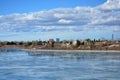 Icy lake view of park and city. Royalty Free Stock Photo