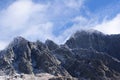 Icy mountains in cloudy sky. Royalty Free Stock Photo