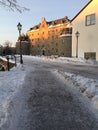 Icy sidewalk and Ãârebro castle Royalty Free Stock Photo