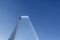 Transparent ice. Icy trapezoid shape against the blue sky. Concept for design or news about the cold, winter, global warming or pe