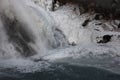 Icy Water Flowing Over Rocks into Pool Royalty Free Stock Photo