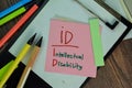 ID - Intellectual Disability write on sticky notes isolated on Wooden Table