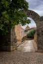 Idanha a velha castle wall entrance with cathedral church on the background, in Portugal Royalty Free Stock Photo