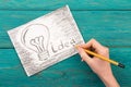 Idea concept - bulb drawn with pencil Royalty Free Stock Photo