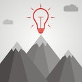 Idea concept. Idea light bulb at the top of a mountain