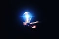 Idea concept. Man with glowing light bulb in darkness Royalty Free Stock Photo