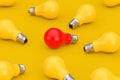 Idea Concept. One Red Light Bulb in Heap of Yellow Light Bulb. 3d Rendering