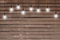 Idea concept - Vintage incandescent bulbs on wooden wall Royalty Free Stock Photo