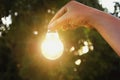 Idea hand holding light bulb concept solar of energy