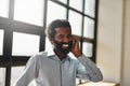 Idea, happy and communication business man at office with a smile or mindset of future success. Thinking, mobile contact Royalty Free Stock Photo