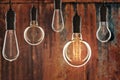 Idea and leadership concept Vintage incandescent Edison bulbs on Royalty Free Stock Photo