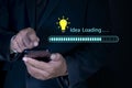 Idea loading concept with light bulb and loading bar. Creative and idea sign, solution, thinking concept. Businessman using smart Royalty Free Stock Photo