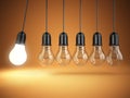 Idea o creativity concept. Light bulbs and perpetual motion. Royalty Free Stock Photo