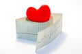 Idea photo arrhythmias and heart diseases related to disorders of normal heart rhythm. Model red heart lies on top of the roll of