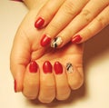 The idea for a red manicure with a pattern.