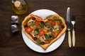 Idea of romantic dish on Valentine`s day: heart shaped pizza with mushrooms and chicken on wooden background.