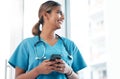 Idea, social media and doctor with a phone for communication, email and schedule. Thinking, ambition and woman nurse Royalty Free Stock Photo