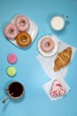 Ideal breakfast for the proper energy for the full day. Fresh coffee with milks and donuts . Hipster pictures. Top view Royalty Free Stock Photo