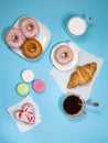 Ideal breakfast for the proper energy for the full day. Fresh coffee with milks and donuts . Hipster pictures. Top view Royalty Free Stock Photo