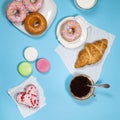 Ideal breakfast for the proper energy for the full day. Fresh coffee with milks and donuts . Hipster pictures. Top view Royalty Free Stock Photo