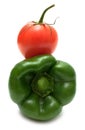 Ideal couple green bell pepper and tomato isolated on white