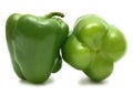 Ideal couple green bell peppers isolated on white
