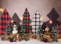 Personalized Christmas decoration with lights animals, snowman and snowy pine trees for studio photography