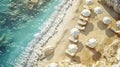 Ideal paradise beach with golden sand, umbrellas, and luxury equipment on a sunny day. Part of the shot needs to