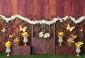 Romantic personalized decor with colorful spring flowers, barn door, rehearsal vases studio photography