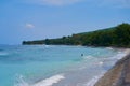 An ideal untouched ocean beach with clear, calm turquoise water