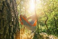 Backpacker relaxing in the hammock in the forest Royalty Free Stock Photo