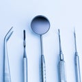 Dentist basic cutlery instruments tools, mirror, tweezers, sonde, tamper caries Royalty Free Stock Photo