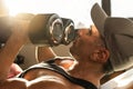 Strong man, bodybuilder exercising with dumbbells in a gym Royalty Free Stock Photo