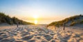 Wooden path at Baltic sea over sand dunes with ocean view, sunset summer evening Royalty Free Stock Photo