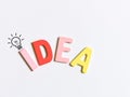 Ideas and innovation concept. Word idea made of colourful wooden alphabet against white background.