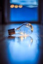 Ideas and innovation: Light bulb with LEDs is lying on the wooden floor. Window and light in the blurry background