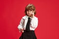 Ideas. Portrait of smart, cute little girl, child in white blouse, black skirt and big glasses raising finger against Royalty Free Stock Photo