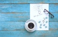 Ideas and problem solution concept with lightbulb scribble, puzzle pieces and a cup of coffee, creativity, business challenge con