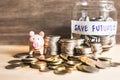 An ideas of saving money for the future with coins and piggy bank Royalty Free Stock Photo