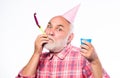 Ideas seniors birthday celebrations. Elderly people. Man bearded grandpa with birthday cap and drink cup. Grandfather Royalty Free Stock Photo