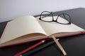 Ideas will come soon. Blank notebook whit Black glasses Royalty Free Stock Photo