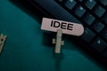 Idee write on a sticky note isolated on Office Desk Royalty Free Stock Photo