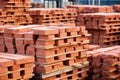 identical red bricks stacked after production