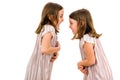 Identical twin girls sisters are arguing yelling at each other Royalty Free Stock Photo