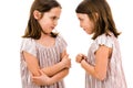 Identical twin girls sisters are arguing yelling at each other Royalty Free Stock Photo