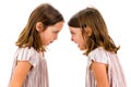 Identical twin girls sisters are arguing yelling at each other Royalty Free Stock Photo