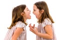 Identical twin girls sisters are arguing yelling at each other Royalty Free Stock Photo