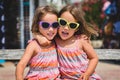 Identical twin girls on summer vacation posing for camera. Royalty Free Stock Photo