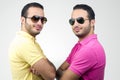 Identical twins portraits shot against white background Royalty Free Stock Photo