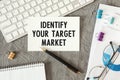 Identify Your Target Market is written in a document on the office desk